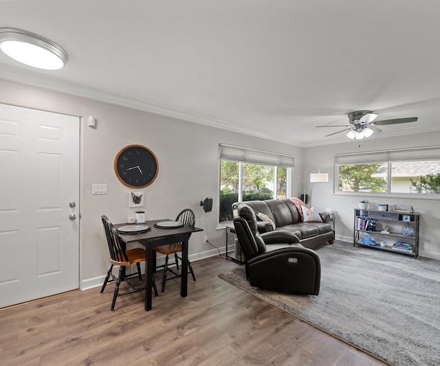 700 Devonshire Rd, Fowlerville, MI 48836 - living area featuring ornamental molding, wood finished floors, and ceiling fan