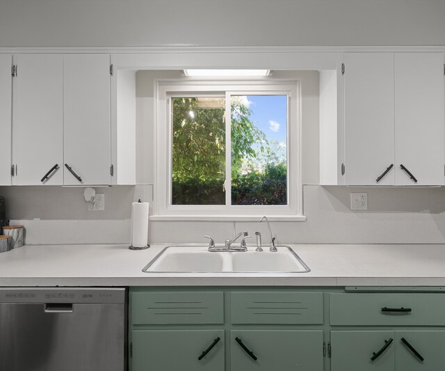 700 Devonshire Rd, Fowlerville, MI 48836 - kitchen with dishwasher, green cabinets, light countertops, and white cabinets