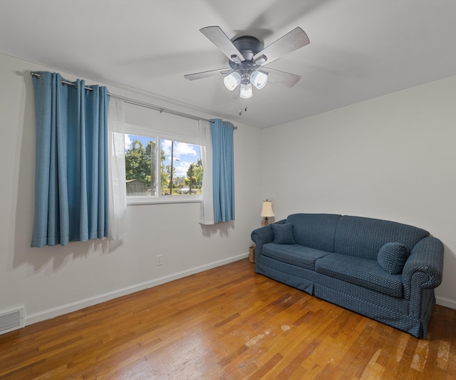 700 Devonshire Rd, Fowlerville, MI 48836 - living room featuring wood finished floors and a ceiling fan