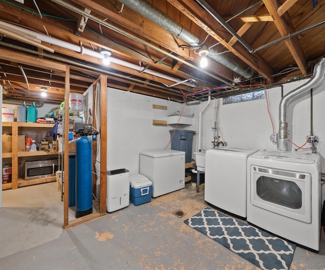 700 Devonshire Rd, Fowlerville, MI 48836 - unfinished below grade area featuring washing machine and dryer, refrigerator, and a water softener system