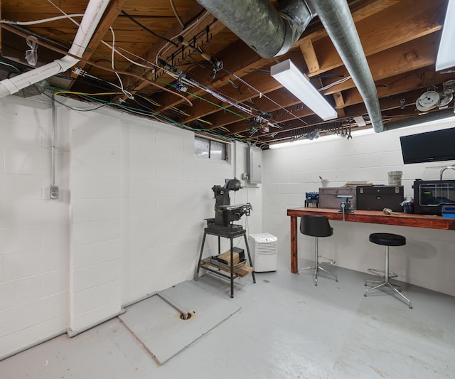 700 Devonshire Rd, Fowlerville, MI 48836 - unfinished basement with electric panel and concrete block wall