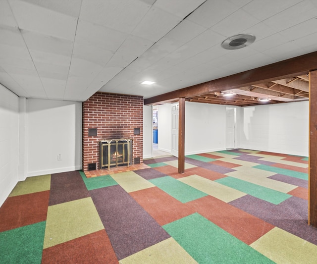 700 Devonshire Rd, Fowlerville, MI 48836 - finished below grade area featuring a fireplace and tile patterned floors