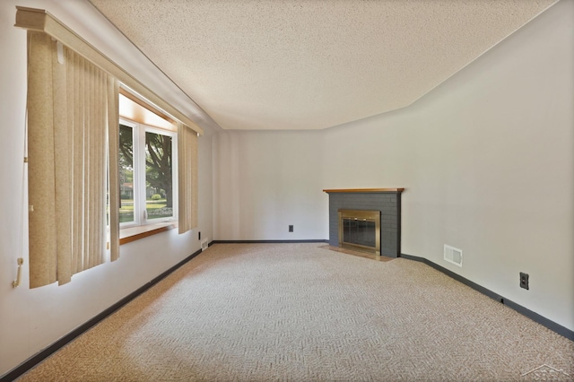 2113 Bock Rd, Saginaw, MI 48603 - unfurnished living room featuring carpet flooring, a fireplace, and a textured ceiling