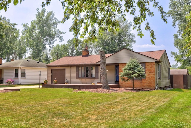 2113 Bock Rd, Saginaw, MI 48603 - ranch-style home with an attached garage, a chimney, a front lawn, and brick siding