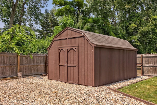2113 Bock Rd, Saginaw, MI 48603 - view of shed with a fenced backyard and view of wooded area