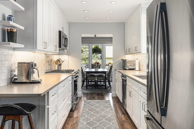 113 Ponds View Dr, Ann Arbor, MI 48103 - kitchen featuring stainless steel appliances, light countertops, recessed lighting, open shelves, and white cabinetry