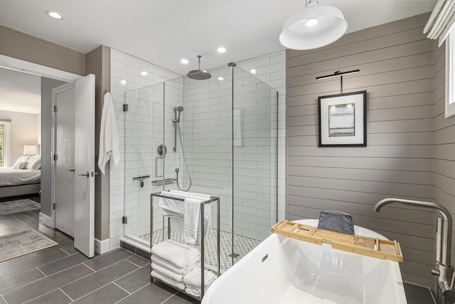 113 Ponds View Dr, Ann Arbor, MI 48103 - bathroom featuring a shower stall, a freestanding bath, ensuite bath, recessed lighting, and tile patterned flooring