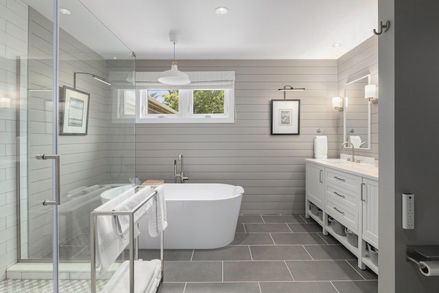 113 Ponds View Dr, Ann Arbor, MI 48103 - bathroom featuring vanity, a shower stall, tile patterned floors, and a freestanding bath