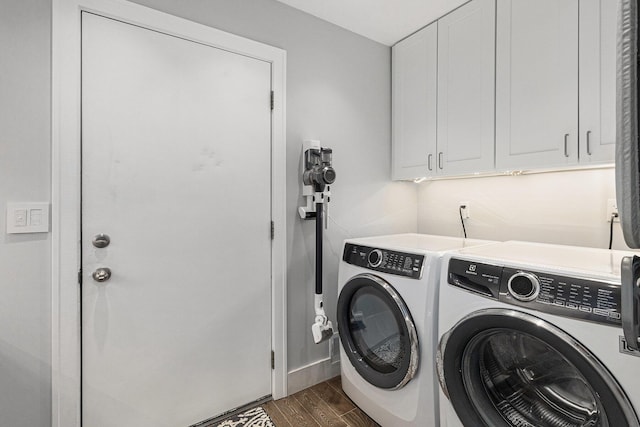 113 Ponds View Dr, Ann Arbor, MI 48103 - laundry room with washer and clothes dryer, cabinet space, and dark wood-style floors
