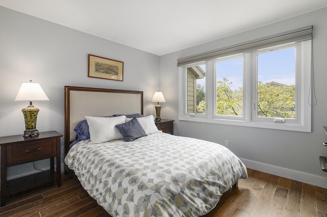 113 Ponds View Dr, Ann Arbor, MI 48103 - bedroom featuring dark wood-style floors and baseboards