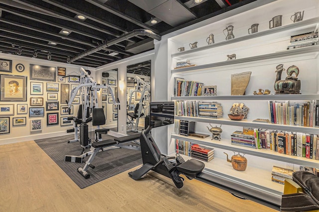113 Ponds View Dr, Ann Arbor, MI 48103 - exercise room with wood finished floors and baseboards