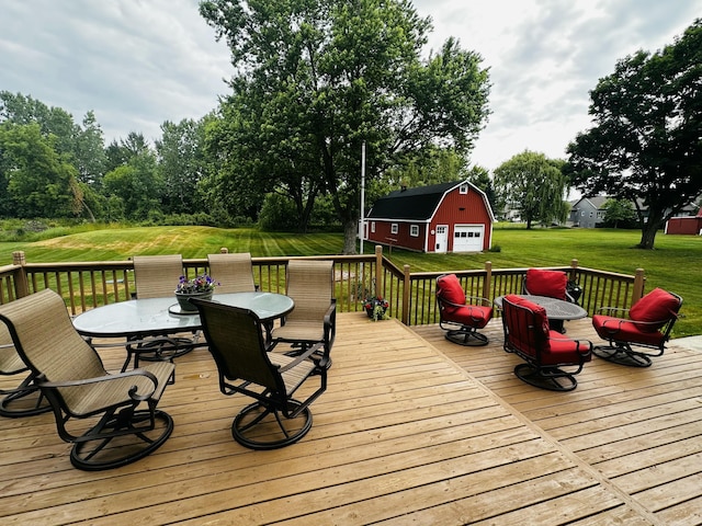 937 Alles Dr SW, Byron Center, MI 49315 - wooden deck with a detached garage, outdoor dining space, an outbuilding, and a yard