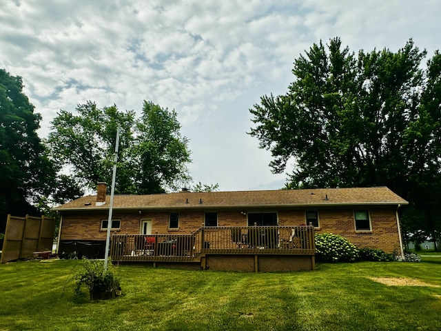 937 Alles Dr SW, Byron Center, MI 49315 - rear view of property featuring brick siding, a yard, and a deck
