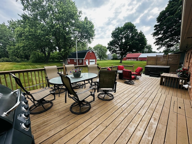 937 Alles Dr SW, Byron Center, MI 49315 - wooden deck with outdoor dining space, a yard, and an outbuilding