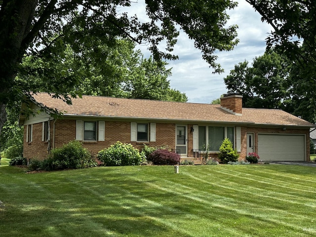 937 Alles Dr SW, Byron Center, MI 49315 - ranch-style home featuring an attached garage, a front yard, brick siding, a chimney, and asphalt driveway