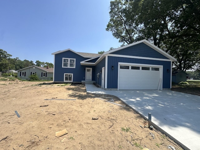 572 Agnes St, Muskegon, MI 49442 - split level home with driveway and an attached garage