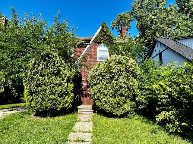 14869 Mark Twain St, Detroit, MI 48227 - view of front of house with a chimney and brick siding