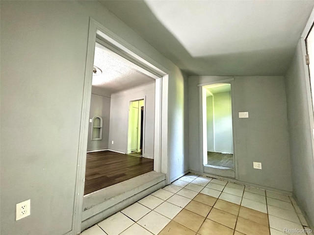 14869 Mark Twain St, Detroit, MI 48227 - empty room with light tile patterned floors and baseboards