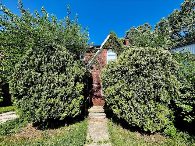 14869 Mark Twain St, Detroit, MI 48227 - view of front of home with a chimney and brick siding