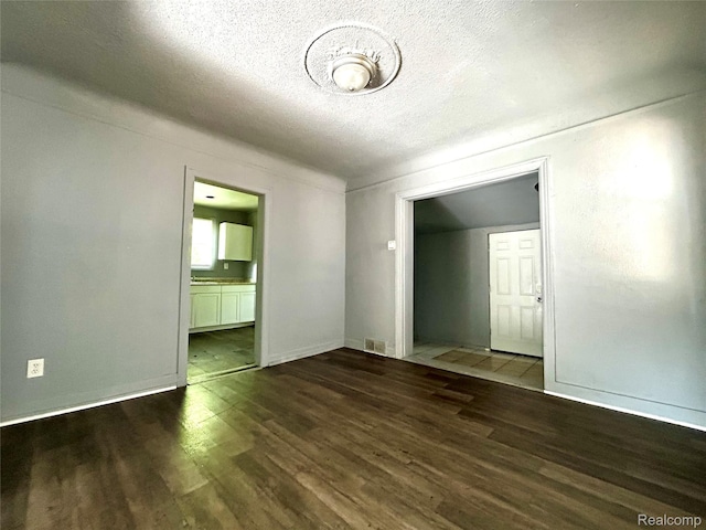 14869 Mark Twain St, Detroit, MI 48227 - empty room featuring wood finished floors and a textured ceiling