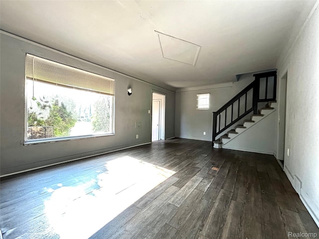 14869 Mark Twain St, Detroit, MI 48227 - unfurnished living room featuring wood finished floors, attic access, and stairs