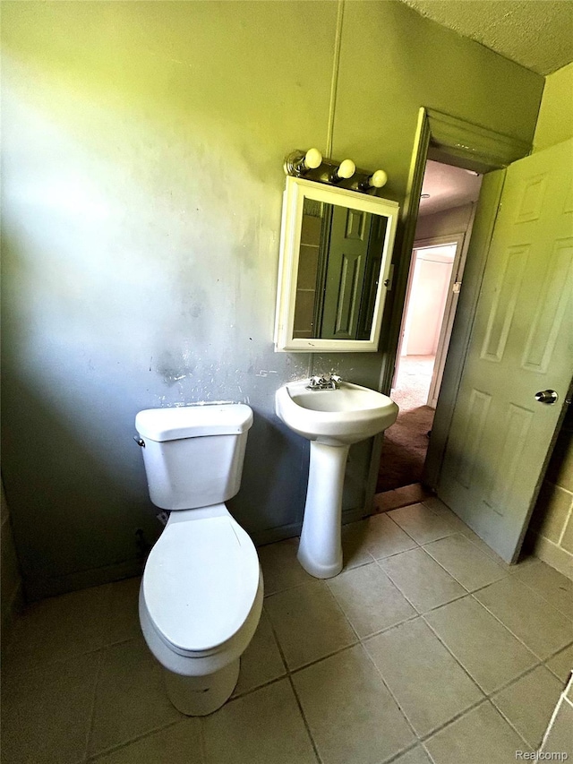 14869 Mark Twain St, Detroit, MI 48227 - bathroom featuring tile patterned floors and toilet