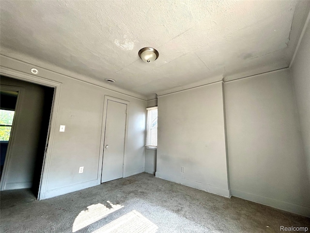 14869 Mark Twain St, Detroit, MI 48227 - unfurnished bedroom with a textured ceiling, carpet, and a closet