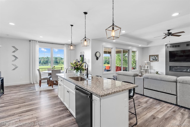 6264 Hidden Forrest, Swartz Creek, MI 48473 - kitchen featuring stainless steel dishwasher, open floor plan, recessed lighting, and healthy amount of natural light
