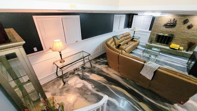 28740 Tavistock Trl, Southfield, MI 48034 - living room featuring a decorative wall, a wainscoted wall, and a fireplace