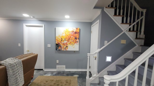 28740 Tavistock Trl, Southfield, MI 48034 - entrance foyer featuring crown molding, stairway, and recessed lighting