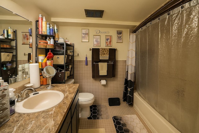 28740 Tavistock Trl, Southfield, MI 48034 - full bath with tile patterned flooring, vanity, a wainscoted wall, tile walls, and shower / bathtub combination with curtain