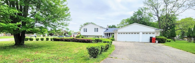 28740 Tavistock Trl, Southfield, MI 48034 - tri-level home featuring asphalt driveway, a front yard, and an attached garage