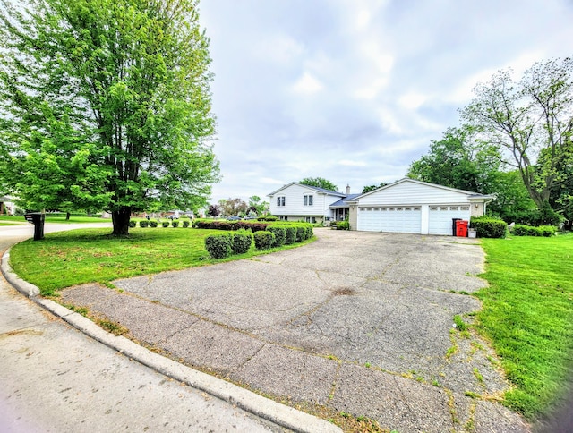 28740 Tavistock Trl, Southfield, MI 48034 - view of front of house with a garage and a front lawn