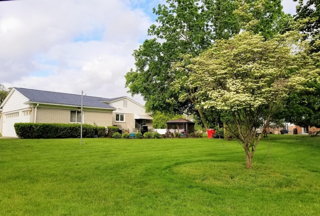 28740 Tavistock Trl, Southfield, MI 48034 - view of grassy yard featuring a gazebo and a garage