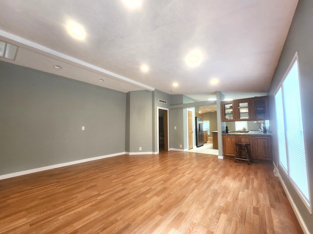 6580 Deerfield Trl, Lake, MI 48632 - unfurnished living room featuring light wood-type flooring and recessed lighting