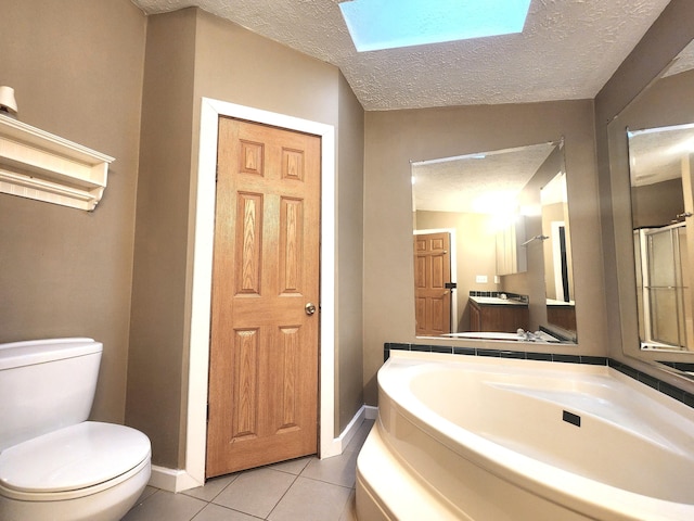 6580 Deerfield Trl, Lake, MI 48632 - bathroom featuring a skylight, tile patterned flooring, a textured ceiling, vanity, and a bath