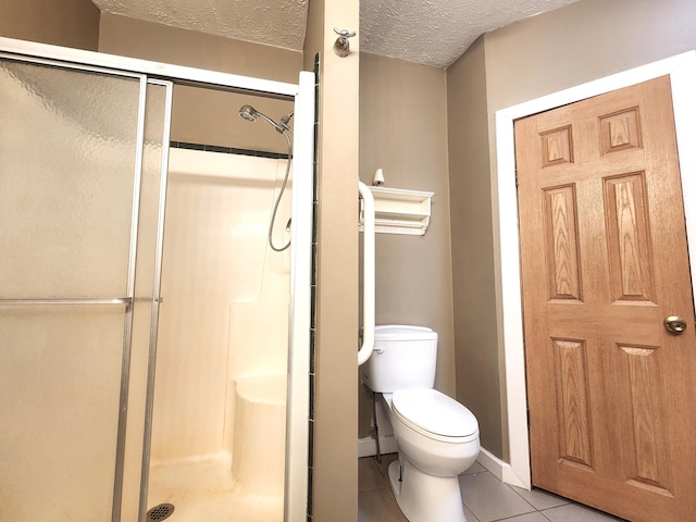 6580 Deerfield Trl, Lake, MI 48632 - bathroom with a shower stall, tile patterned floors, and a textured ceiling