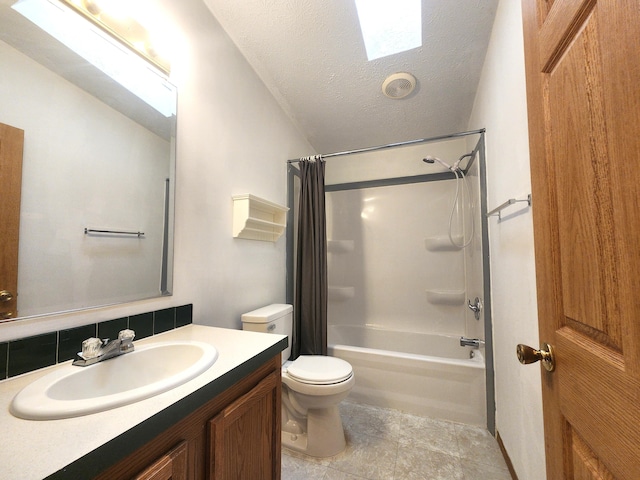 6580 Deerfield Trl, Lake, MI 48632 - full bath featuring shower / bathtub combination with curtain, a skylight, vanity, a textured ceiling, and vaulted ceiling