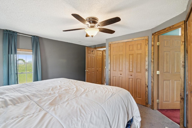 1903 Bucholtz Hwy, Deerfield, MI 49238 - carpeted bedroom featuring a closet, a textured ceiling, and a ceiling fan
