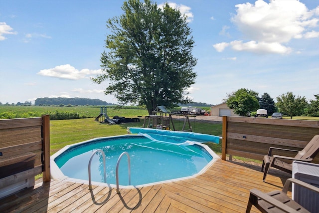 1903 Bucholtz Hwy, Deerfield, MI 49238 - view of pool with a wooden deck, a covered pool, a lawn, and a view of countryside