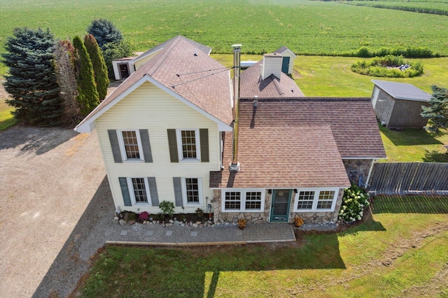1903 Bucholtz Hwy, Deerfield, MI 49238 - back of property with roof with shingles, a patio area, a storage unit, and stone siding