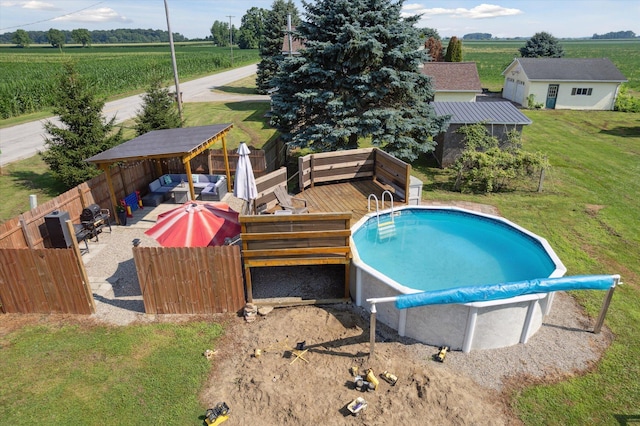 1903 Bucholtz Hwy, Deerfield, MI 49238 - view of swimming pool featuring a rural view, a wooden deck, agricultural area, and outdoor lounge area