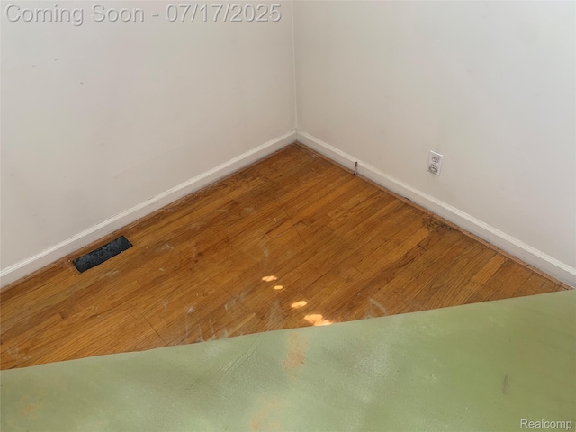 6455 Mayfair St, Taylor, MI 48180 - spare room featuring baseboards and wood finished floors