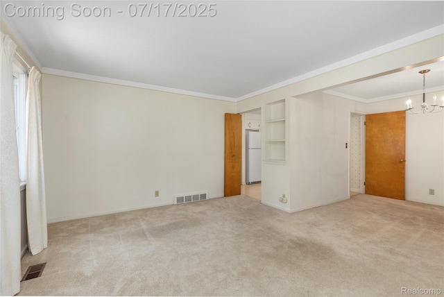 6455 Mayfair St, Taylor, MI 48180 - empty room featuring a chandelier, carpet flooring, ornamental molding, and built in shelves