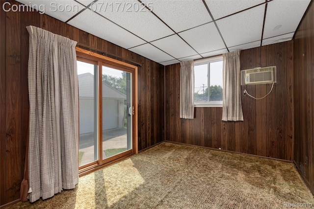 6455 Mayfair St, Taylor, MI 48180 - empty room with plenty of natural light, a paneled ceiling, wooden walls, and a wall mounted AC