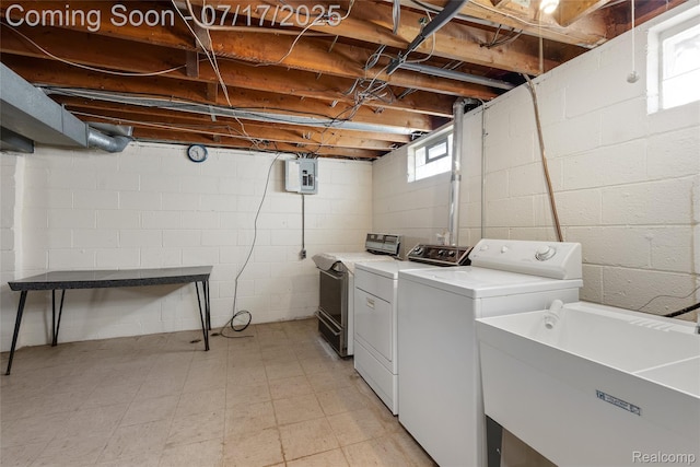 6455 Mayfair St, Taylor, MI 48180 - laundry area featuring washing machine and clothes dryer, light flooring, and electric panel