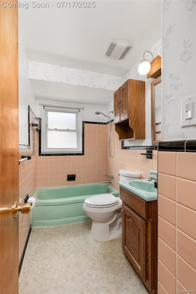 6455 Mayfair St, Taylor, MI 48180 - bathroom featuring vanity, shower / tub combination, and tile walls