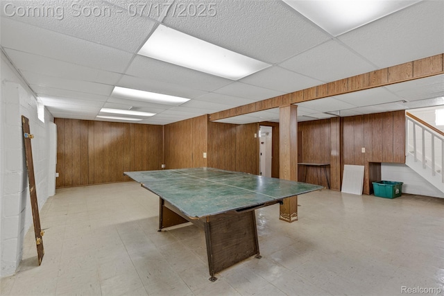 6455 Mayfair St, Taylor, MI 48180 - rec room with wooden walls, a paneled ceiling, and light flooring