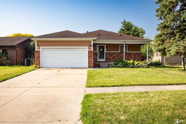 25095 Darin St, Taylor, MI 48180 - view of front facade with an attached garage, a front yard, and brick siding