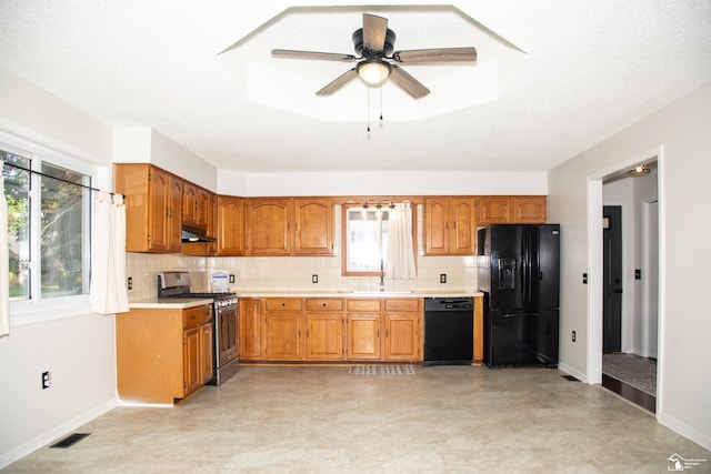 25095 Darin St, Taylor, MI 48180 - kitchen with black appliances, plenty of natural light, and light countertops